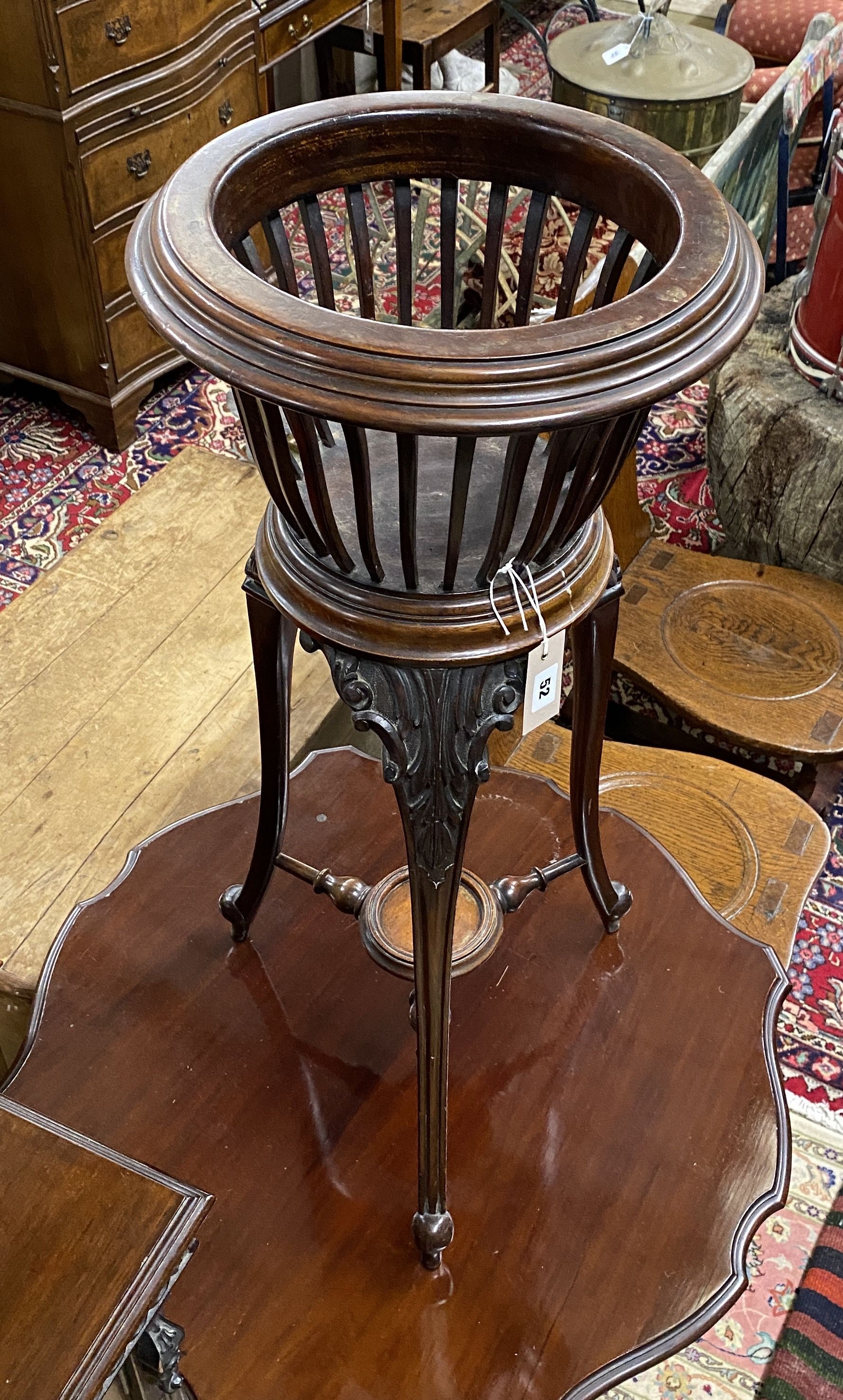 A late Victorian carved mahogany jardiniere, no liner, diameter 36cm, height 82cm